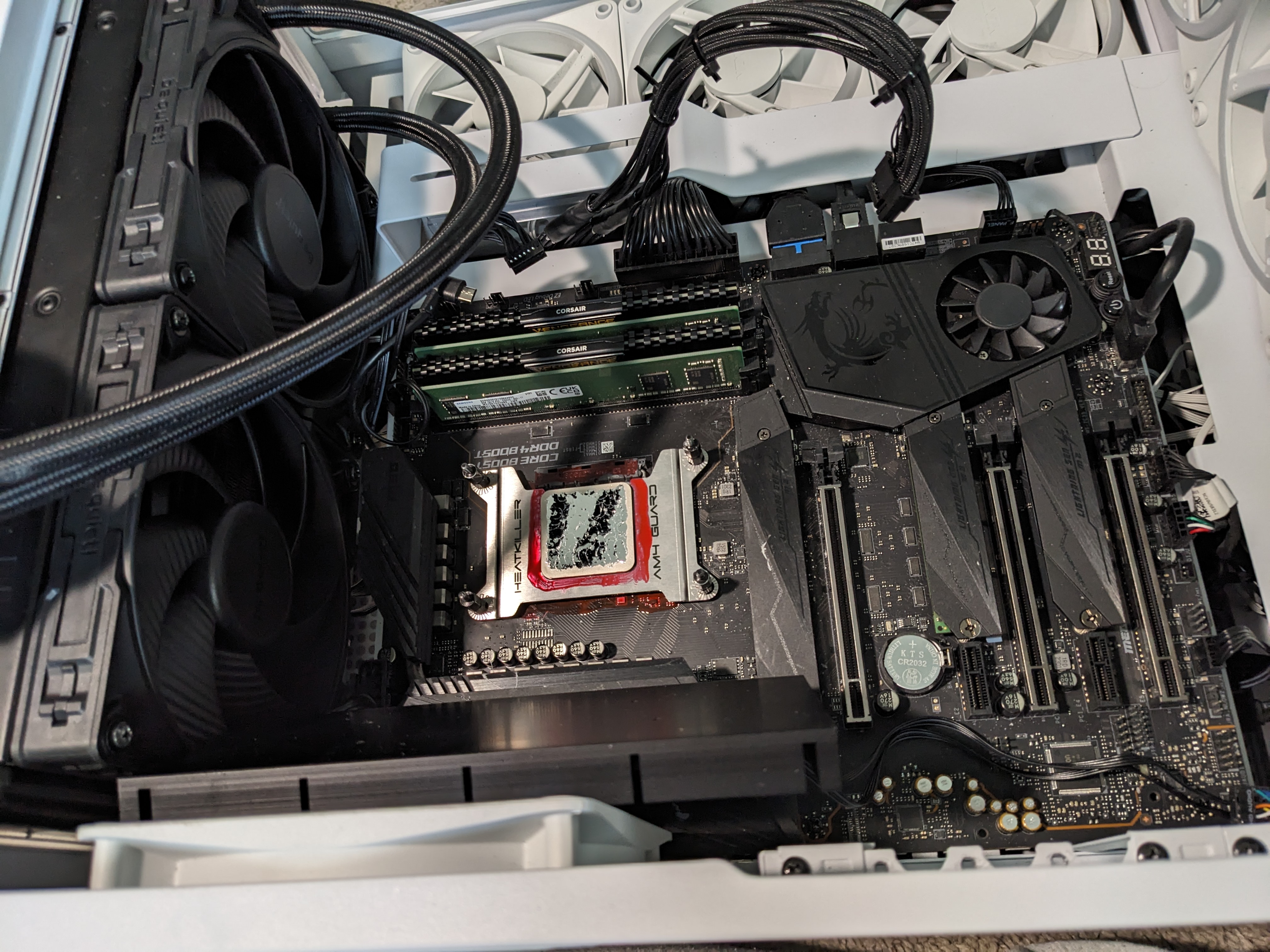 Liquid metal on the CPU — perimeter coated, thermals dropped